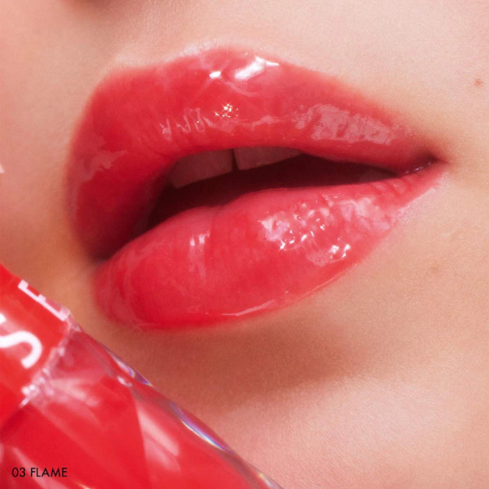 SEPHORA COLLECTION 
Outrageous Plump Intense Hydrating Lip Gloss.    Color: 03 Flame - shimmer free cherry red