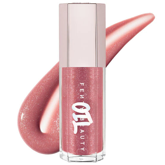 Fenty Beauty by Rihanna 
Gloss Bomb Oil Luminizing Lip Oil 'N Gloss Color: Fu$$Y - sparkling dusty pink