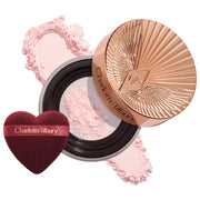 Charlotte Tilbury 
Airbrush Flawless Blur Loose Setting Powder Color: Brightening Pink - ultra brightening for fair-medium skin tones, soft brightening for tan-deep skin tones