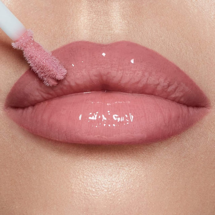 Charlotte Tilbury 
Collagen Lip Bath Gloss Color: Pillow Talk Fair - cool nude pink