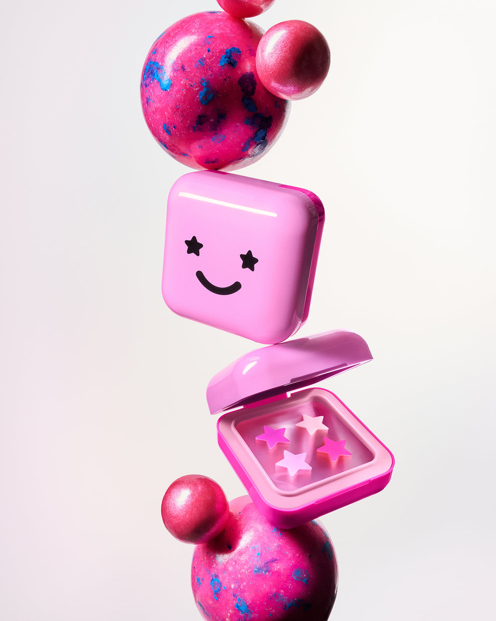 STARFACE hydro-stars® + big pink absorbs. shrinks. protects.  a cute pink  compact filled with 32 pink hydro-stars